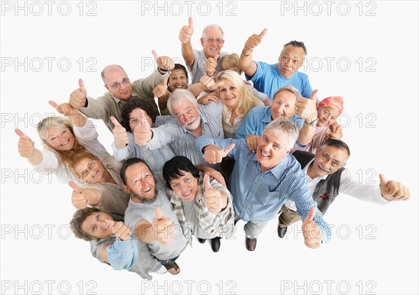 A group of people giving the thumbs up sign. Photo : momentimages