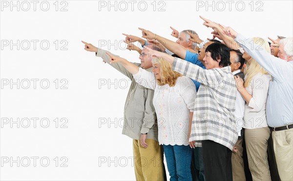 A group of people pointing. Photo : momentimages