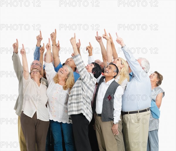 A group of people pointing up. Photo : momentimages