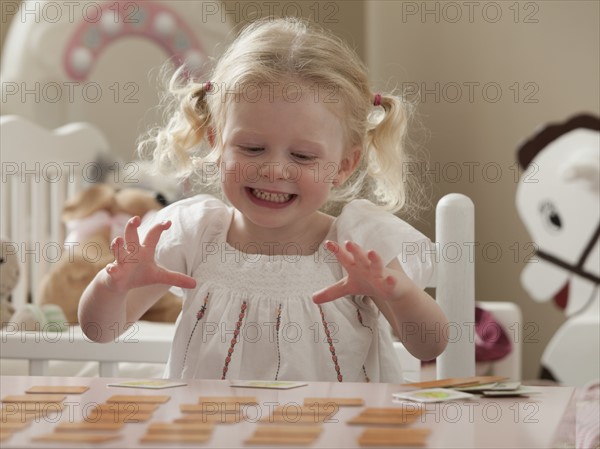 Young girl playing memory game. Photo : Mike Kemp