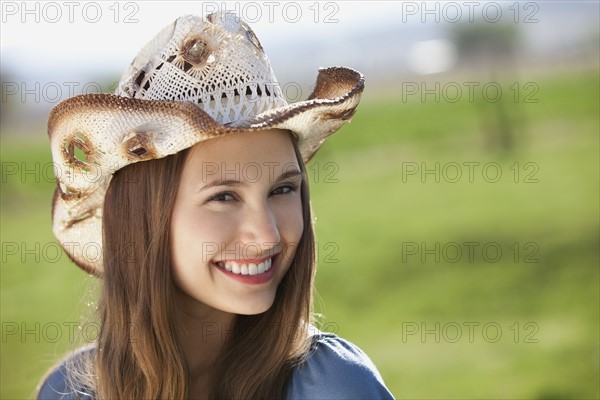 Smiling cowgirl. Photo : Mike Kemp