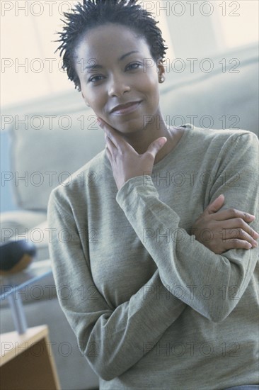 Beautiful woman standing in her home. Photo : Rob Lewine