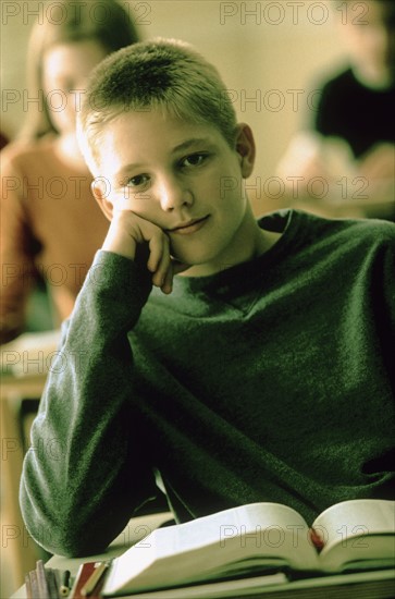 Elementary school student sitting at his desk. Photo : Rob Lewine