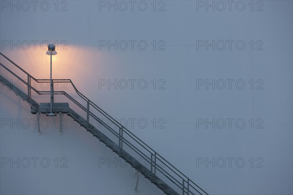 Stairs and light on an oil tank. Photo : Dan Bannister