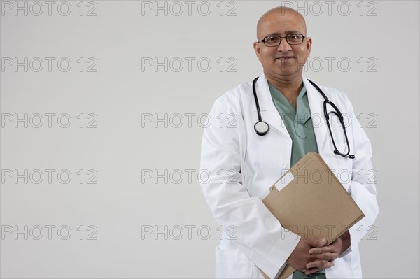 Doctor holding files. Photo : Dan Bannister