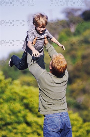 Father playing outside with his young son. Photo : Rob Lewine