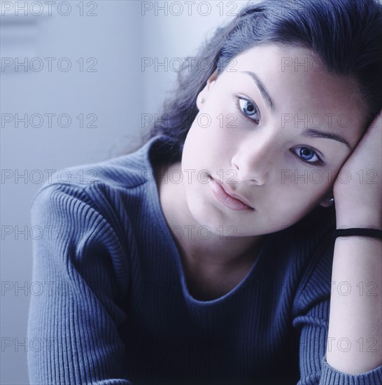 Pretty teenage girl deep in thought. Photo : Rob Lewine