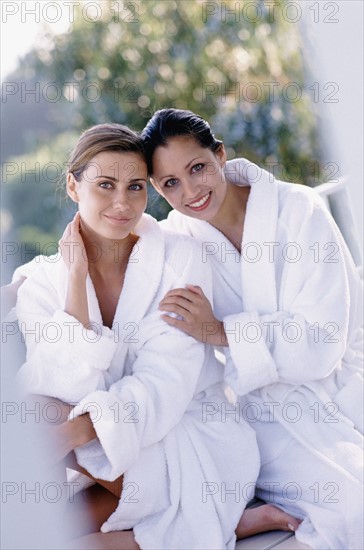 Two woman wearing bath robes. Photo : Rob Lewine