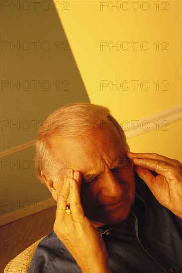 Man with a headache. Photo : Rob Lewine