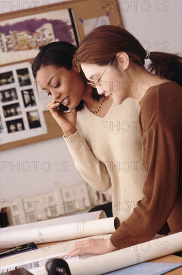 Two woman working in architect's office. Photo : Rob Lewine