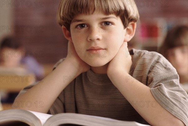 Elementary school student sitting at his desk. Photo : Rob Lewine