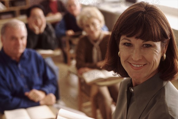 Teacher and students in adult education classroom. Photo : Rob Lewine