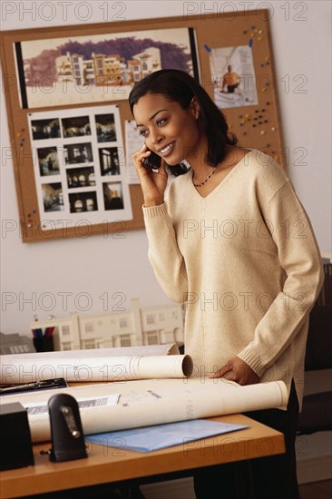 Female architect talking on the phone. Photo : Rob Lewine