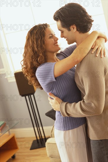 Affectionate couple embracing in their home. Photo : Rob Lewine