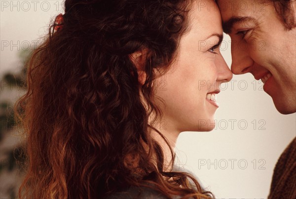 Couple with their foreheads together. Photo : Rob Lewine