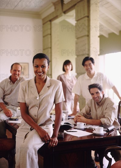 Business colleagues in conference room. Photo : Rob Lewine