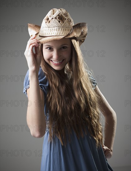 Beautiful long haired cowgirl tipping her hat. Photo : Mike Kemp