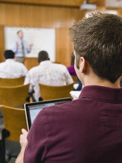 College students in lecture hall.