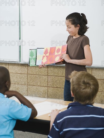 Elementary student giving class presentation.