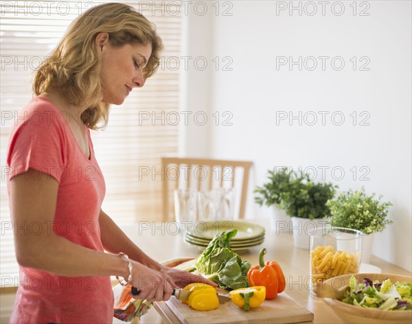 Woman preparing salad.