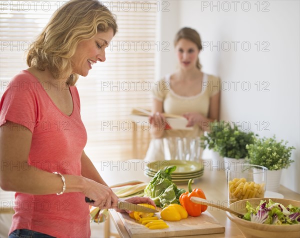 Woman preparing salad.