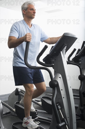 Man exercising on Stairmaster.