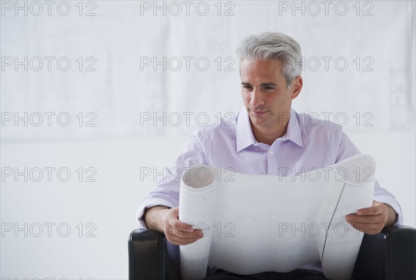 Architect looking at house plans.