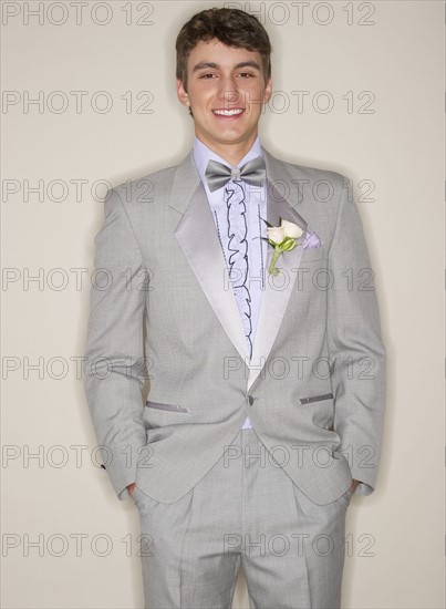 Man wearing grey tuxedo.