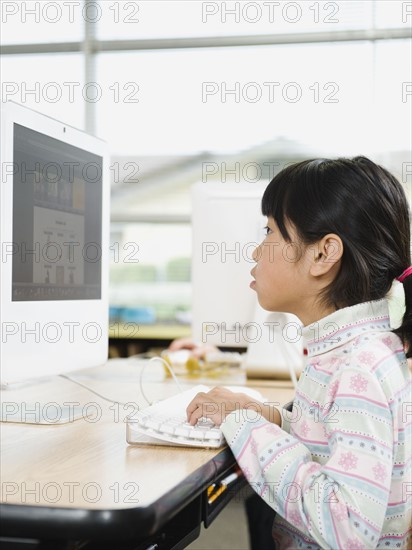 Student working on computer in classroom.