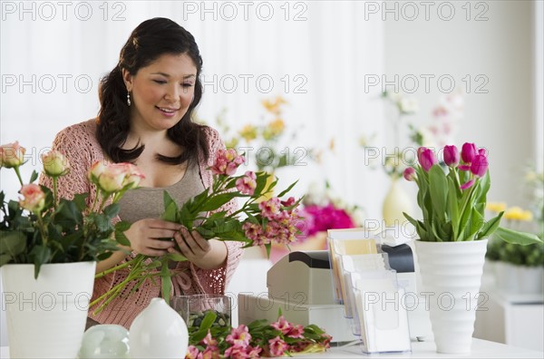 Florist making a floral arrangement.