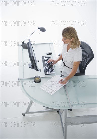 Businesswoman working on laptop.