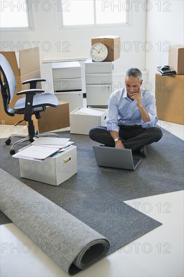 Business entrepreneur working in startup office.