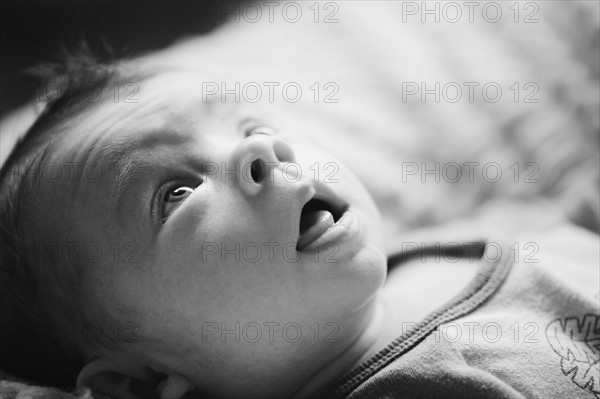 Baby lying down. Photo. Jamie Grill