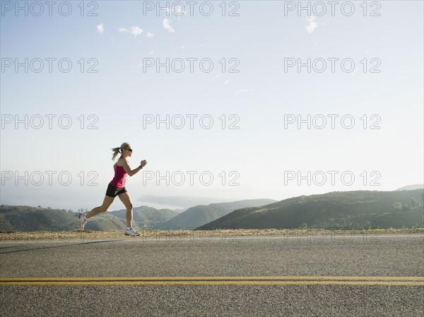 Runner training on the side of the road. Photo. Erik Isakson