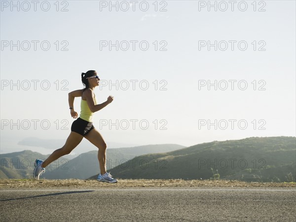 Runner training on the side of the road.