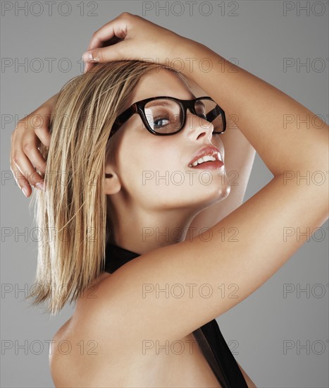 Blond woman wearing only a necktie. Photo : momentimages