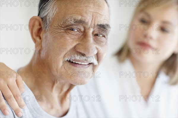 Nurse caring for senior patient. Photo. momentimages