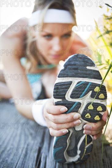 Runner stretching. Photo. Take A Pix Media