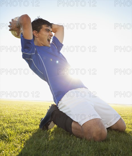 Soccer player throwing ball. Photo. Mike Kemp