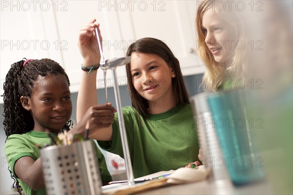 Group of children looking at model windmill. Photo : Tim Pannell