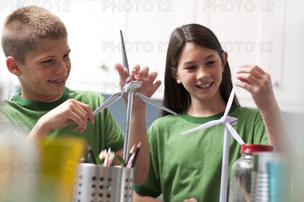 Two children making model windmills. Photo : Tim Pannell