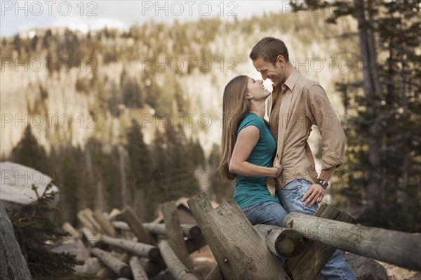 Happy couple embracing in rural setting. Photo. FBP