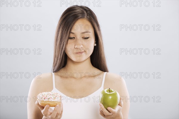 Woman making food choice. Photo. FBP