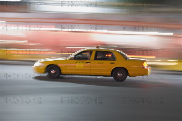 Taxi cab driving at night. Photo. Antonio M. Rosario