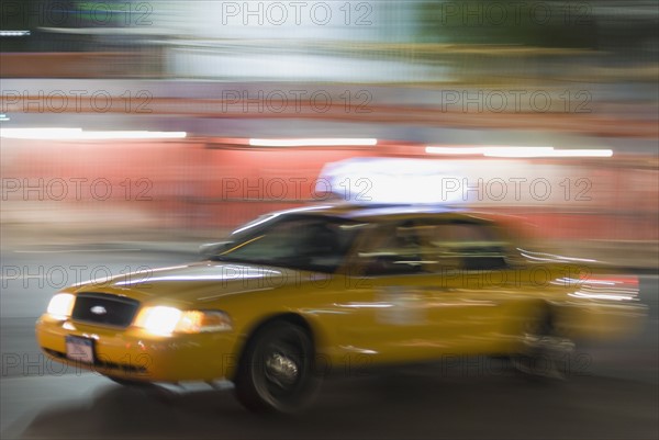 Taxi cab driving at night. Photo : Antonio M. Rosario