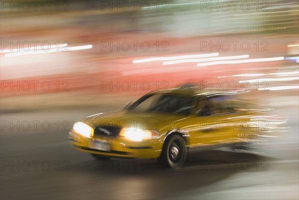 Taxi cab driving at night. Photo : Antonio M. Rosario