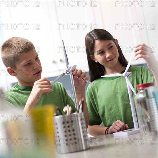 Two children making model windmills. Photo : Tim Pannell