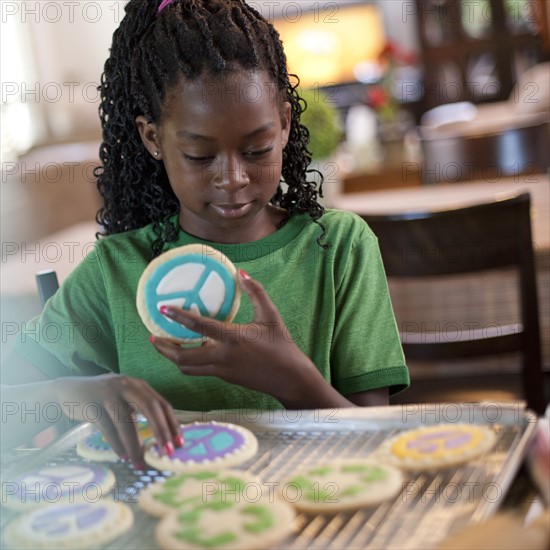 Young girl baking cookies. Photo. Tim Pannell