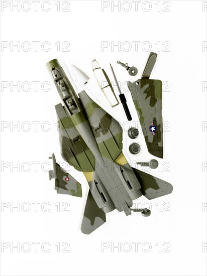 Camouflage toy airplane. Photo. David Arky