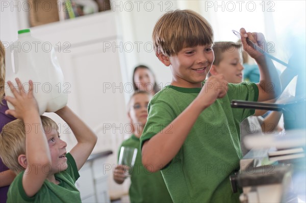 Group of children in kitchen. Photo : Tim Pannell